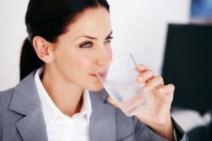 Executive woman drinking water
